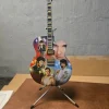 Tradera Elvis Presley Minigitarr - Rockin' Through the Years> Musikmemorabilia