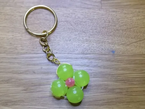 Clearance En nyckelring med grön blomma Nøgleringe & Nøgleetuier