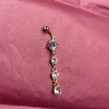 Tradera Guldfärgad navelpiercing> Piercinger
