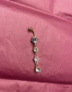 Tradera Guldfärgad navelpiercing> Piercinger
