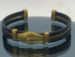 Tradera Äldre guldig armring, bangle, udda, ansikte, profil> Armbånd