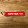 Tradera Remove before flight - nyckelring, ny> Fly