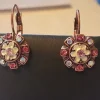 Tradera Örhängen PUSS Design blomma kopparfärg rosa blå vit> Øreringe