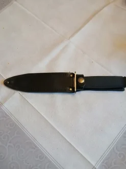 Tradera Överlevnadskniv /Jaktkniv rfr dubbel egg, delvis tandad, kraftig läderslida> Knive & Sværd